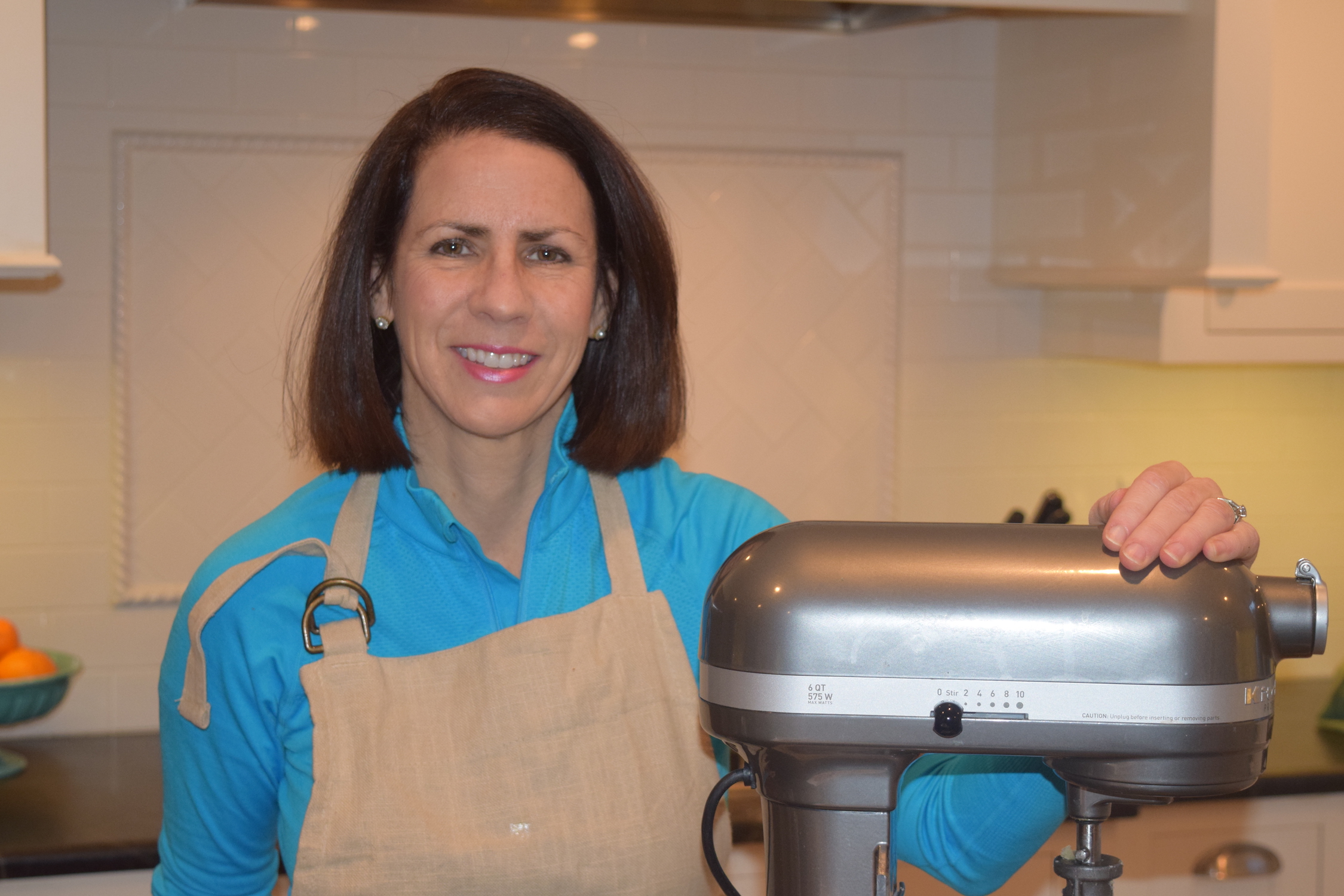 Catherine in her kitchen
                  with mixer